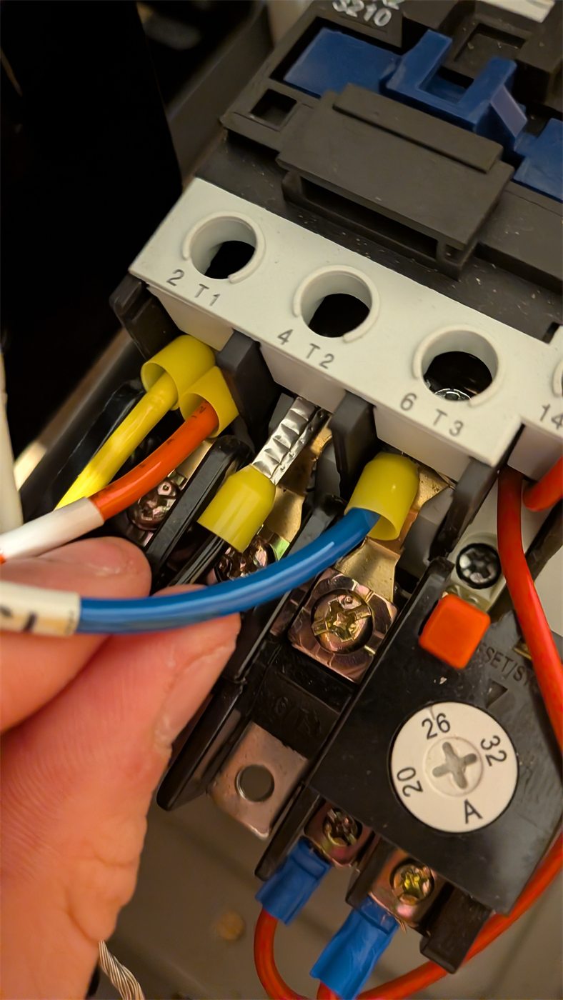 Close-up of relay and starter wiring inside the control system.
